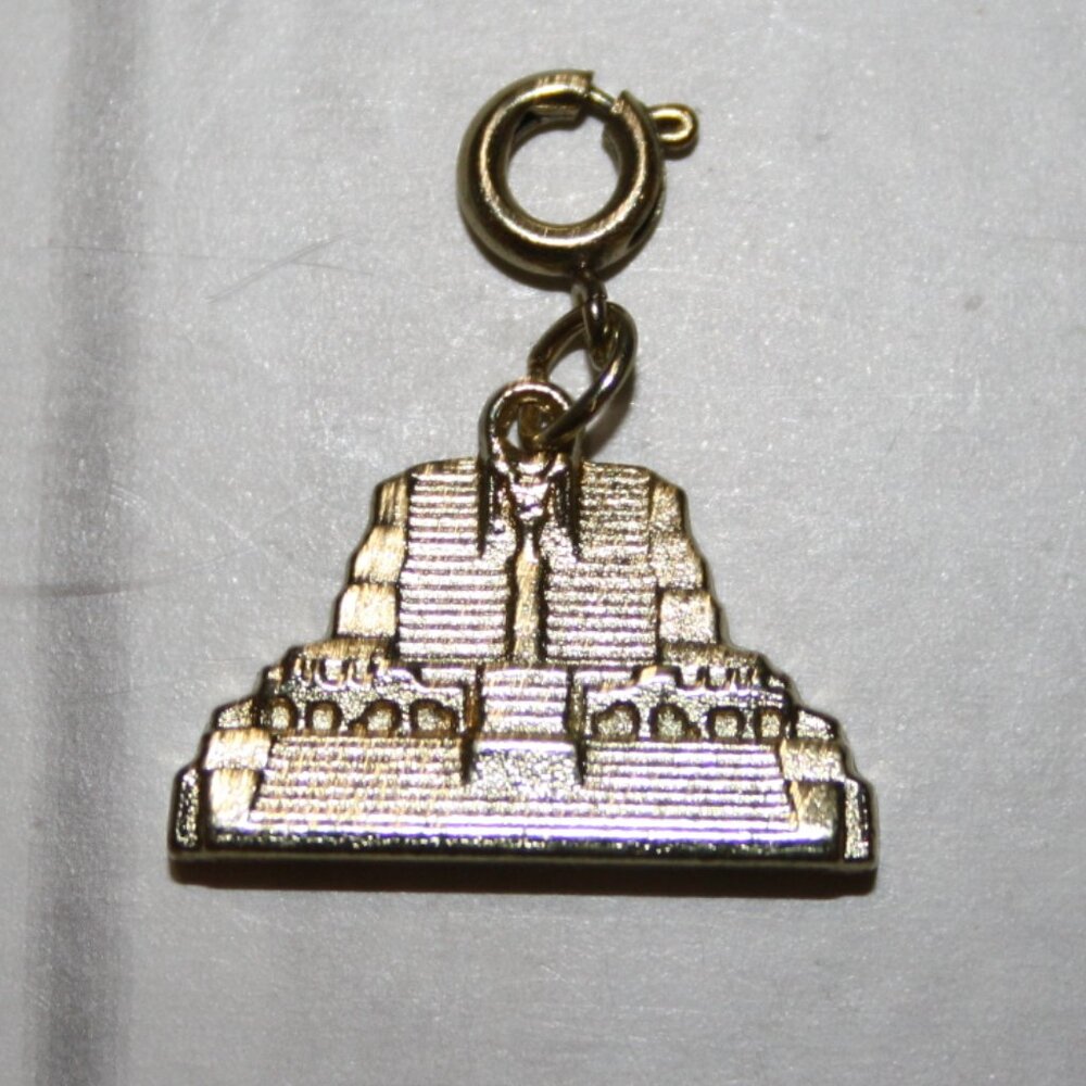 Gold charm from Diamond International 1" tall